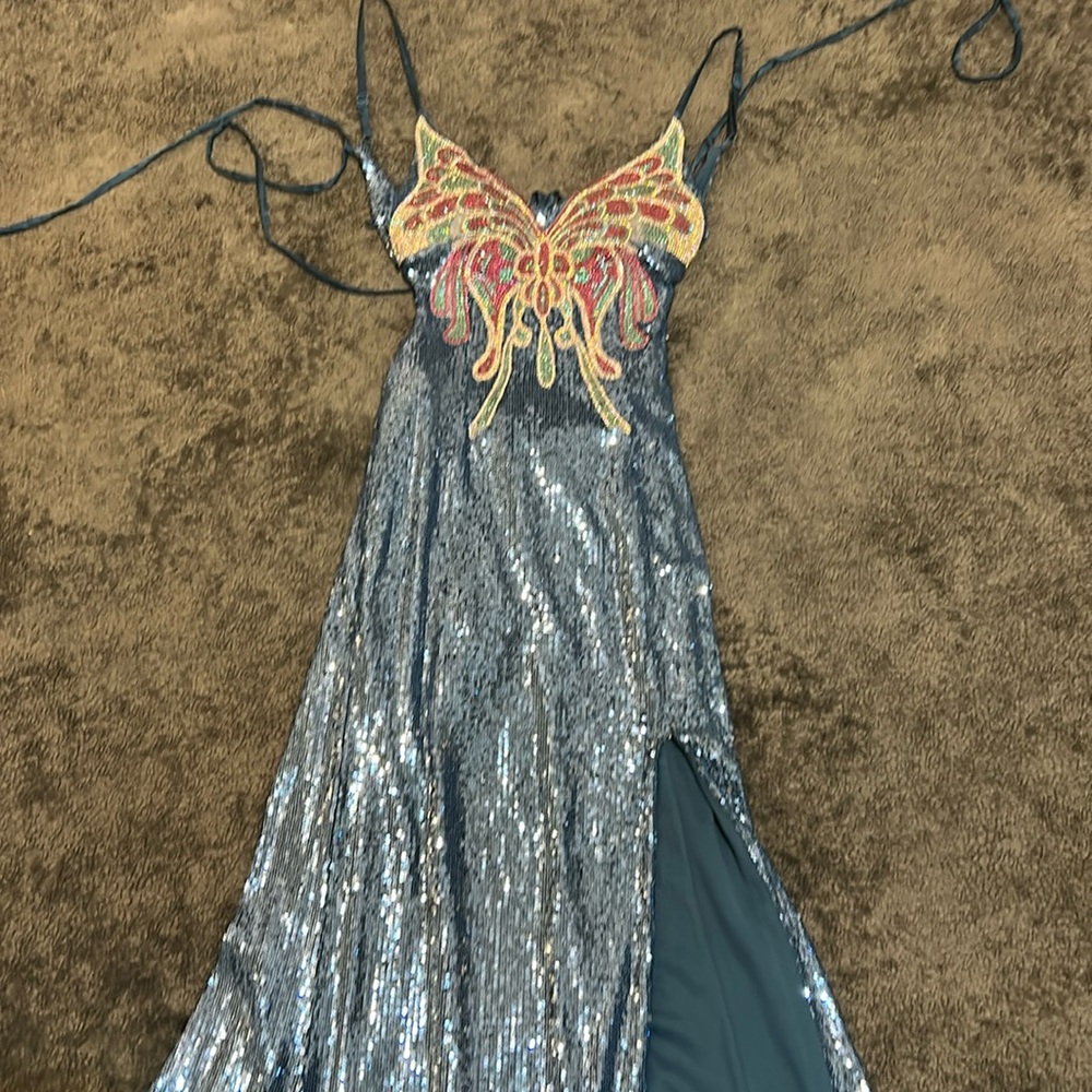 Blue butterfly prom/homecoming dress with a backless top and v-cut.